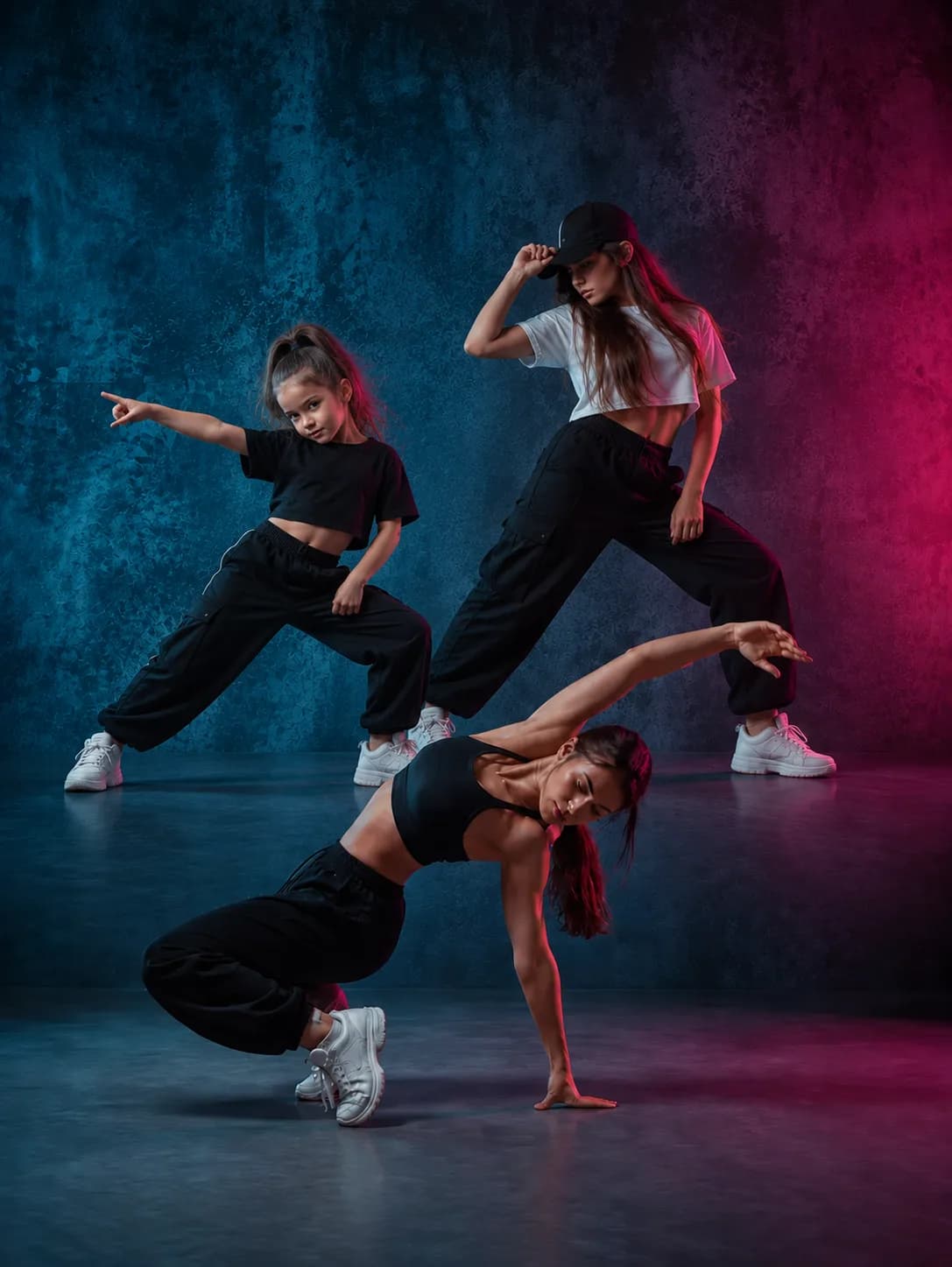 Dancers practicing in a dark studio